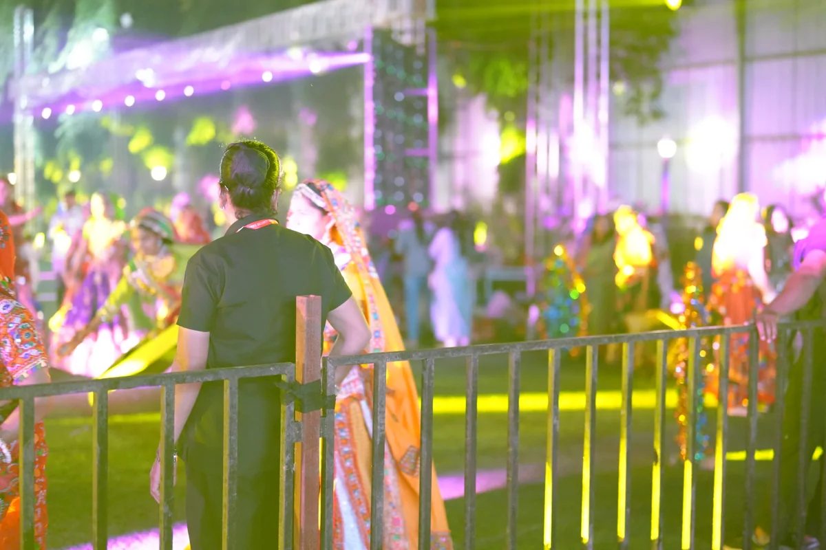 R CORPS security team member at an illuminated event