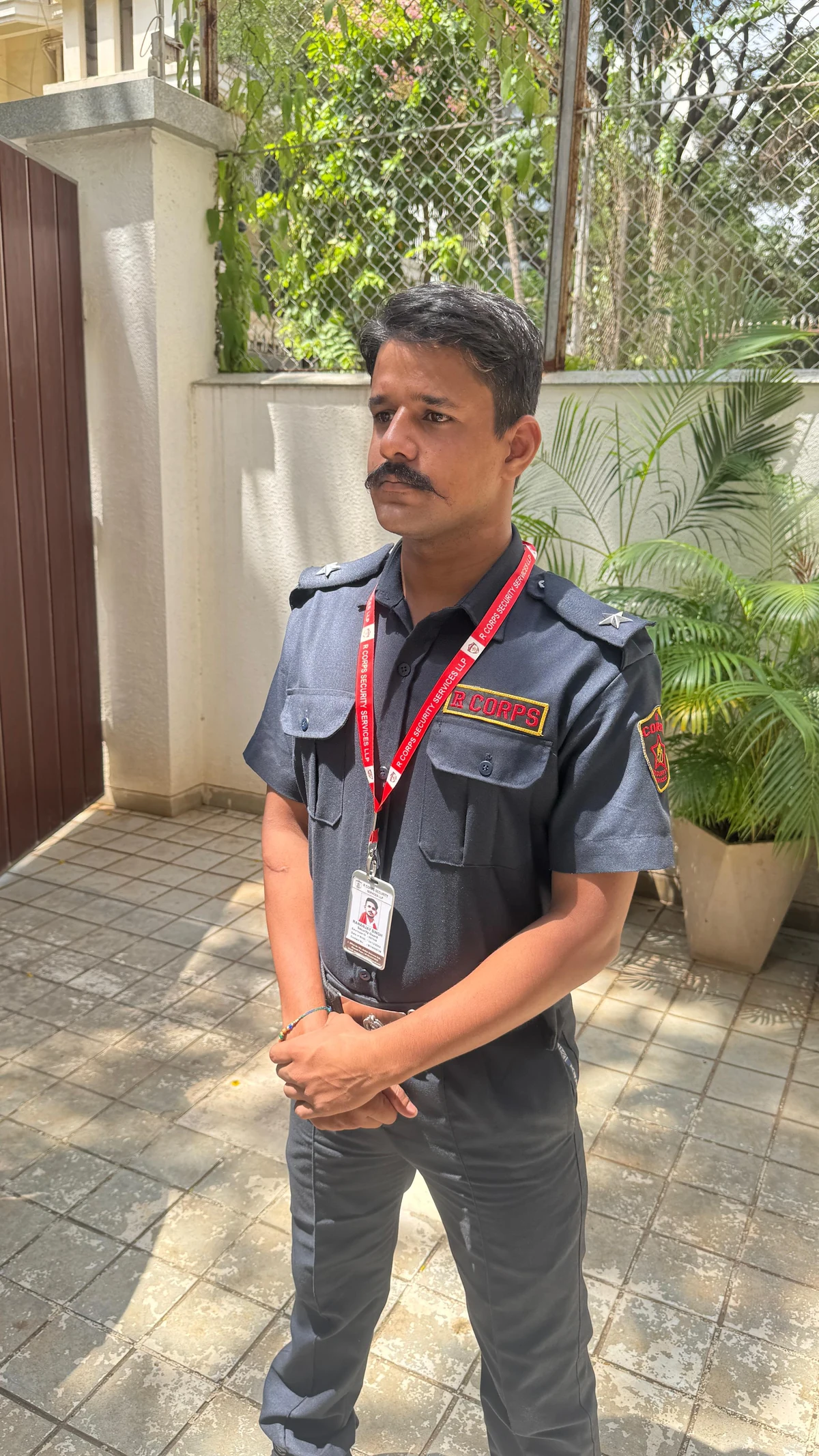 R CORPS uniformed guard at an entrance